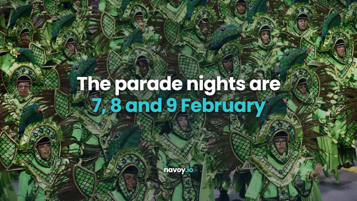 Samba school dancers in green feathered costumes parading at the Rio Carnival Sambadrome