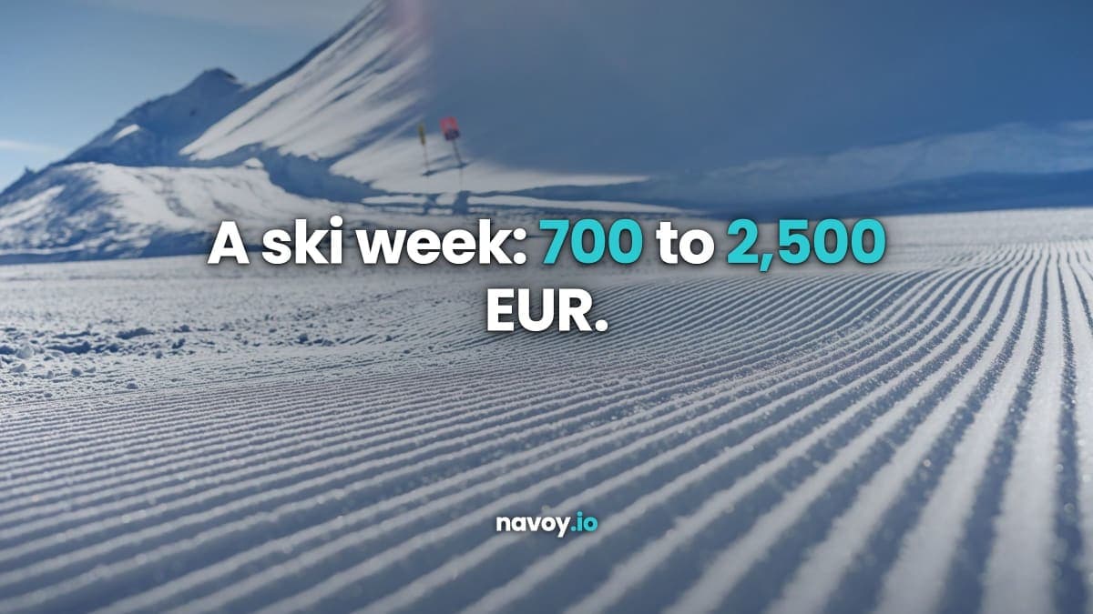 A freshly groomed ski slope with corduroy lines under bright winter sun, snow-covered mountain peak rising behind