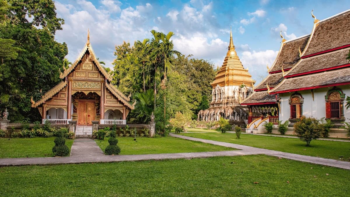 Wat Chiang Man temple in Chiang Mai's old city, with its golden chedi and carved prayer halls set in green lawns
